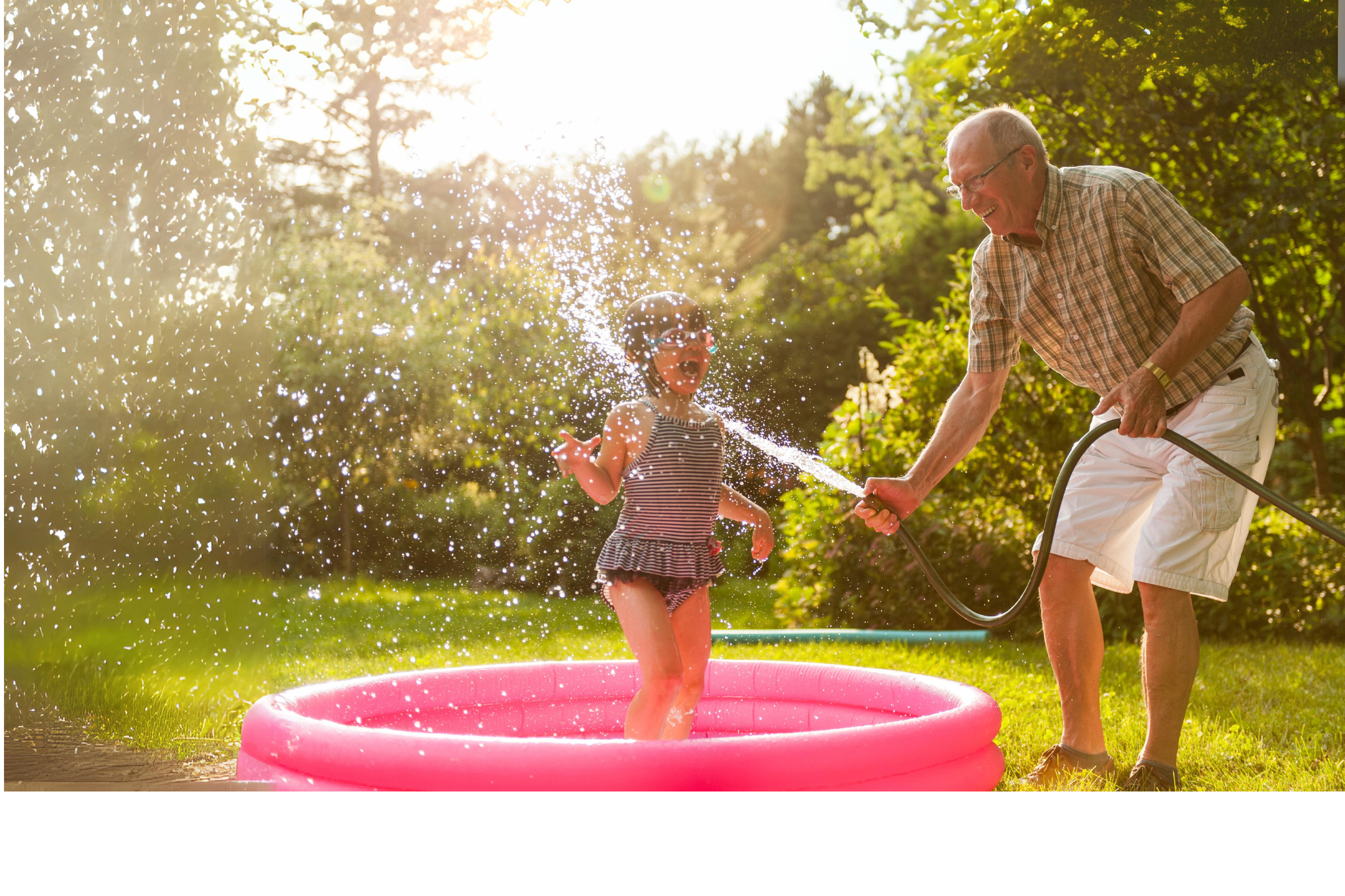 pain-free grandfather playing with his granddaughter outside in the yard